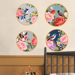 Set of four circular wall decals featuring Chinese bird and floral motifs in a warm bedroom