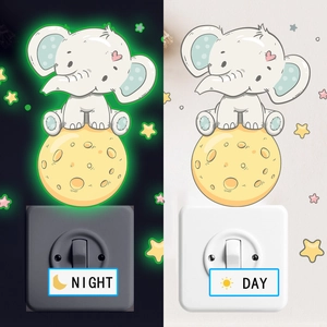 Detailed comparison of luminous cartoon elephant wall stickers in day and night modes