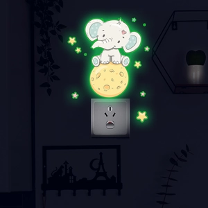 Luminous wall sticker featuring a cute elephant on moon with glowing green stars