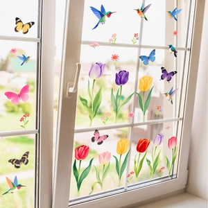 Vibrant tulip flower and butterfly static cling stickers on a glass window pane