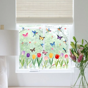 Static window clings featuring colorful hummingbirds, butterflies, and tulip flowers