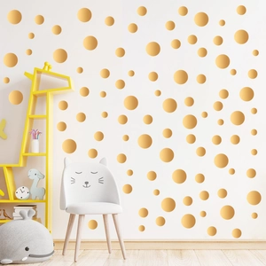 Golden polka dot wall stickers in various sizes for bedroom decor in kids rooms