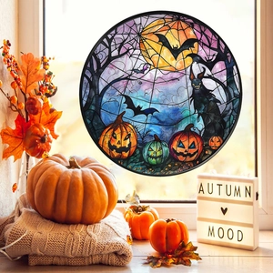 Detail of round stained glass window decal featuring pumpkin bats and full moon scene