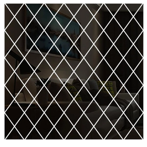 Close-up of modern diamond-shaped acrylic mirror wall stickers on a living room wall