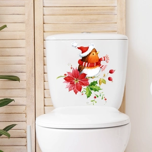 Christmas bird and poinsettia bathroom sticker on a white toilet tank for home decoration