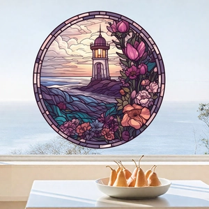 Detail of round stained glass window sticker with coastal lighthouse and floral pattern