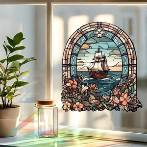 Detailed stained glass window film showing a sailing ship and floral pattern with rainbow light