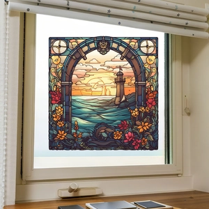 Detail of coastal lighthouse stained glass window film with vibrant sunset and sea waves