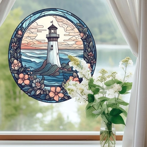 Detail of stained glass window sticker featuring a lighthouse, sea waves, and pink flowers