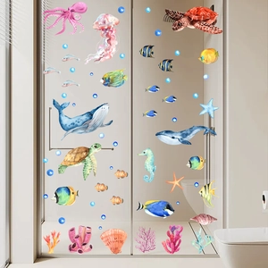 Watercolor ocean theme wall stickers with sea animals on a bathroom glass door