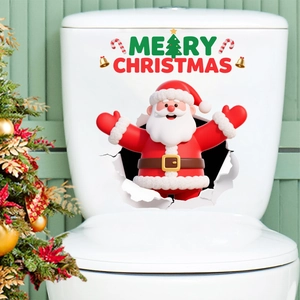 Detailed macro view of 3D Santa Claus wall sticker with Merry Christmas text on toilet tank