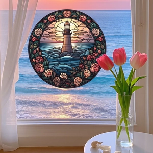 Detail of a lighthouse and rose stained glass window sticker on a bright seaside window