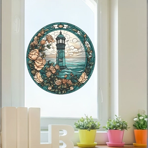 Detail view of lighthouse and roses stained glass window decal on clear glass pane