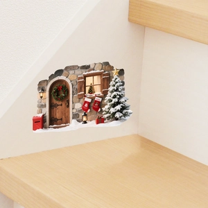Detail showing 3D Christmas wall sticker with festive tree and snowy door on white wall