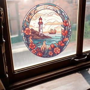 Close-up of circular stained glass window sticker featuring a coastal lighthouse design