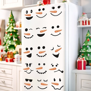 Detail showing various snowman face stickers with carrot noses on a white refrigerator surface