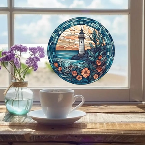 Artistic round lighthouse glass window decal showing sunset and ocean waves detail