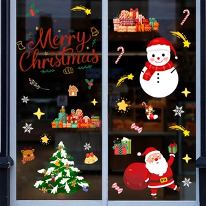 Close-up of static Christmas window stickers with Santa, snowman and Merry Christmas text