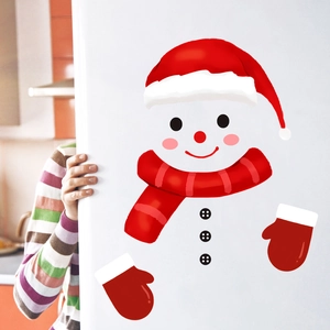 Close-up of cute snowman wall decals on a white fridge door for Christmas decor