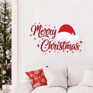 Christmas wall decal with Merry Christmas text and red Santa hat in a cozy living room scene