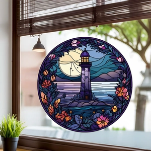 Detail of stained glass lighthouse window cling with floral frame on glass surface