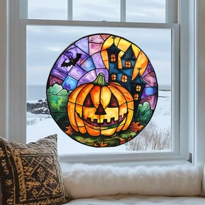 Dettaglio dell'adesivo per finestra di Halloween con zucca e castello colorati