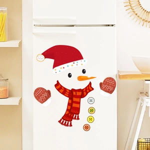 Detailed view of snowman Christmas stickers on a white fridge in a cozy kitchen setting