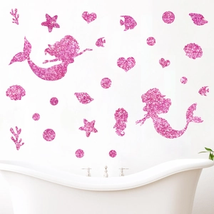 Pink glitter mermaid ocean wall stickers set applied on white bathroom wall above bathtub