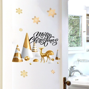 Detail showing gold reindeer, Christmas trees, and snowflakes stickers on a white door panel