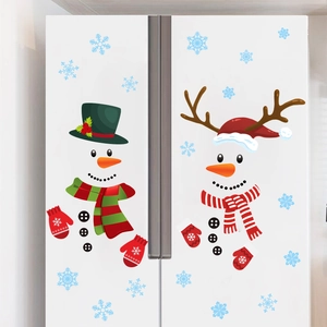 Detail view of snowman Christmas fridge stickers with hats and scarves on white background