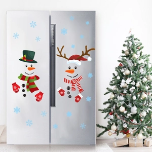 Detailed view of Christmas snowman and reindeer decals on a modern silver refrigerator