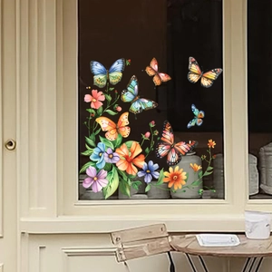 Detail of colorful butterfly and flower window stickers on a shop glass storefront
