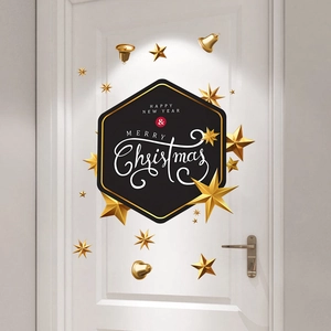 Detail of 3D gold stars and black Merry Christmas door sticker set on a white door