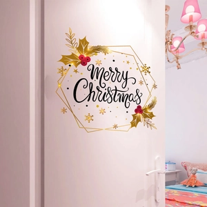 Detail of a Merry Christmas door sticker with gold hexagon frame and red berries