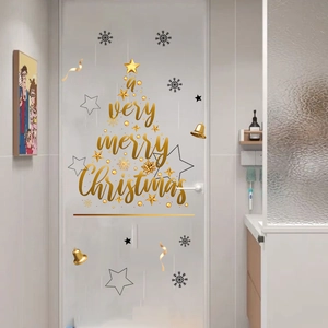 Close-up of golden Christmas tree wall decal with a very merry Christmas lettering