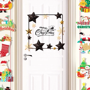 Detail of Christmas wall decals with Santa, snowmen and Merry Christmas typography on white door