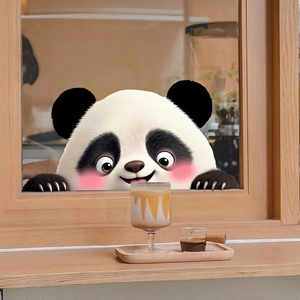 Close-up of a cute panda window cling on glass in a cozy indoor cafe setting