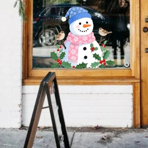 Window detail showing a cute snowman sticker with blue hat and pink floral scarf