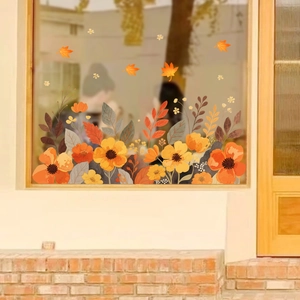 Autumn window static cling decals with yellow floral patterns and orange maple leaves