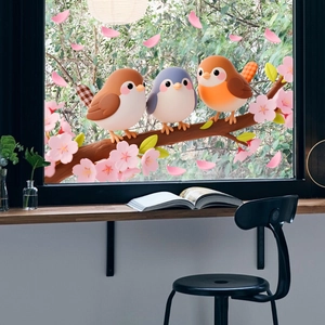 Detail of static bird and flower window stickers on glass for home decoration