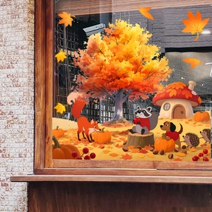 Detail of autumn window clings featuring maple trees, pumpkins and forest animals