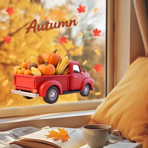 Macro detail of red harvest truck window decals with pumpkins and Hello Autumn text