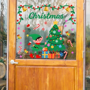 Close-up of colorful PVC Christmas window clings featuring elves and festive wreaths