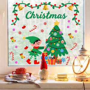 Festive Christmas window stickers with Santa, tree, and bells on a glass window scene