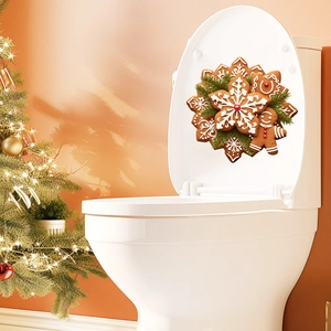 Detail of 3D gingerbread man and snowflake toilet sticker with warm festive lighting