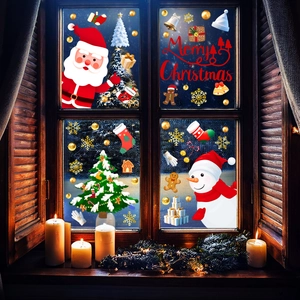 Close-up of Santa and snowman static window stickers on a snowy glass window scene