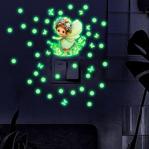 Luminous wall stickers showing a fairy girl and glowing butterflies in dark night scene