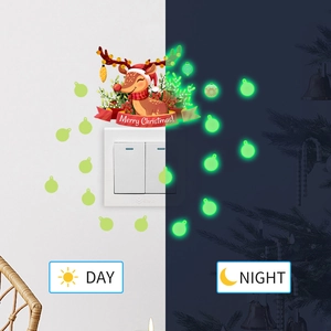 Luminous reindeer wall sticker showing day and night glow effect on a light switch