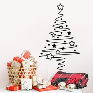 Close-up of black vinyl Christmas tree wall decal with spiral lines and stars for home decor