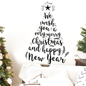 Christmas tree wall sticker with holiday greetings shown in a cozy living room scene